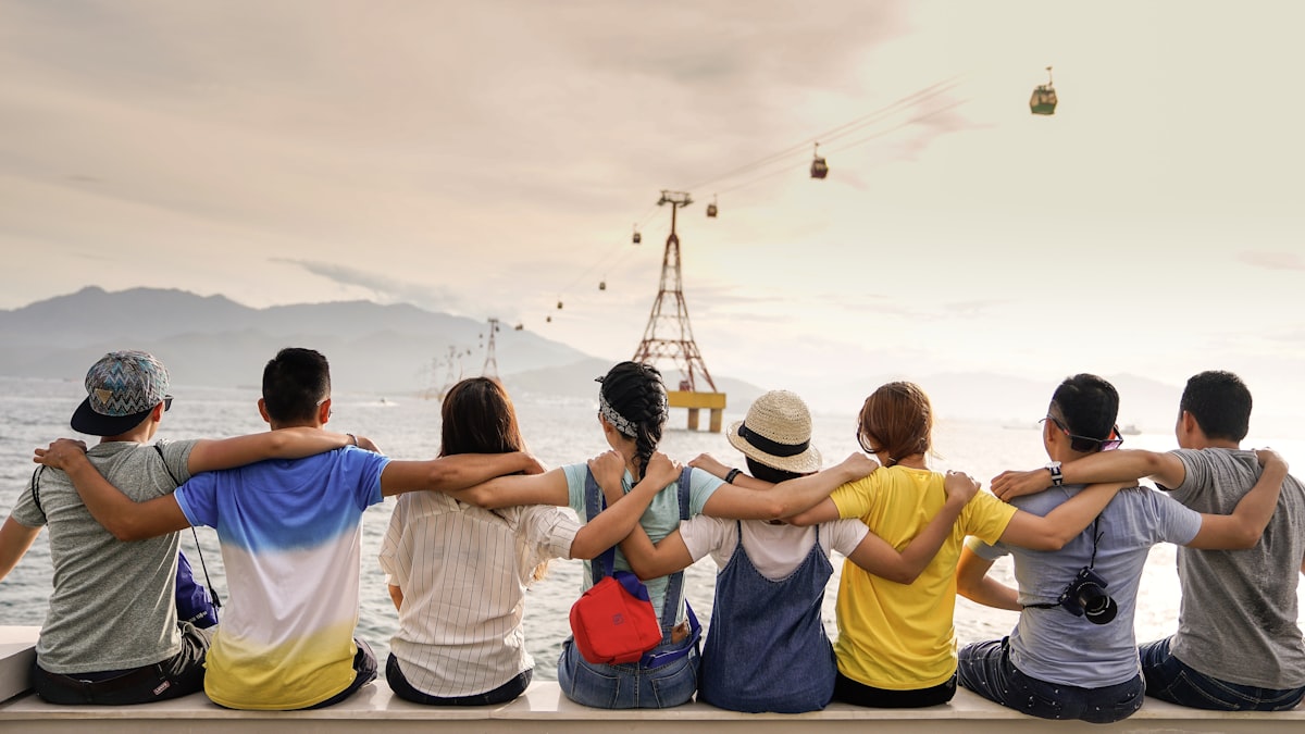 A group of friends by the water, representing the remote-work lifestyle of Portugal's D8 digital nomad visa